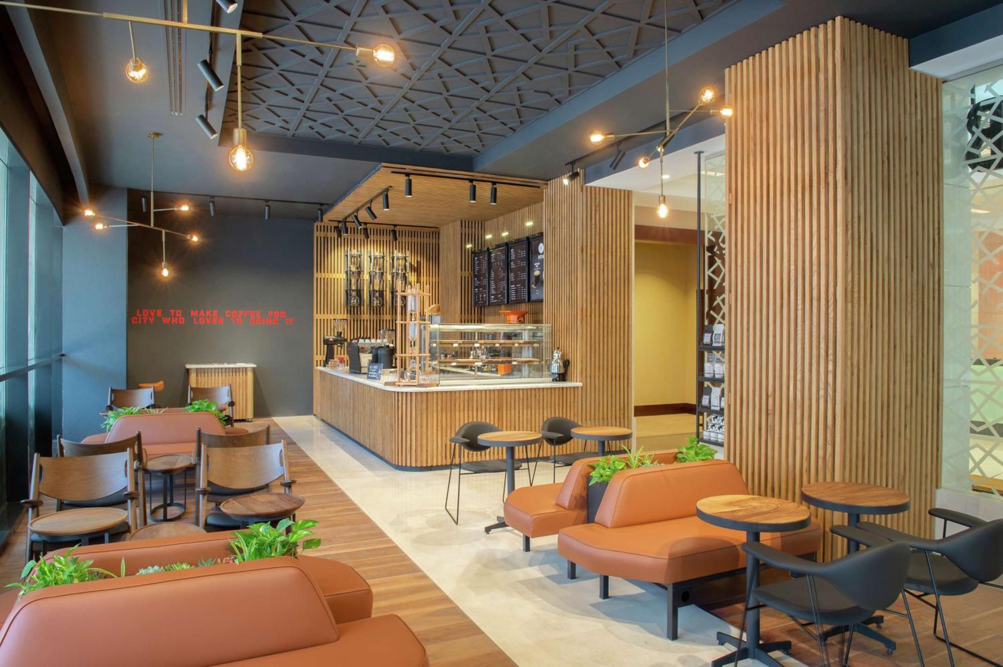 Doubletree By Hilton Doha - Al Sadd Hotel Exterior photo Interior of a Starbucks Reserve store in Seoul, South Korea
