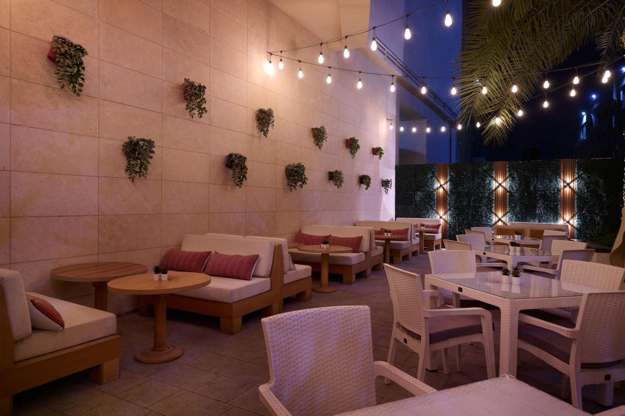 Doubletree By Hilton Doha - Al Sadd Hotel Exterior photo The patio at the restaurant